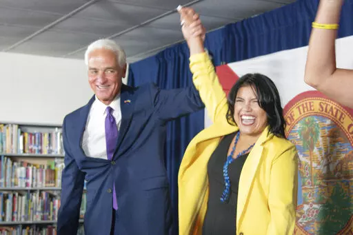 U.S. Rep. Charlie Crist celebrates as he announces his running mate Karla Hernández-Mats at Hialeah Middle School in Hialeah, Fla., Saturday Aug. 27, 2022 as he challenges Republican Gov. Ron DeSantis in November (AP Photo/Gaston De Cardenas)