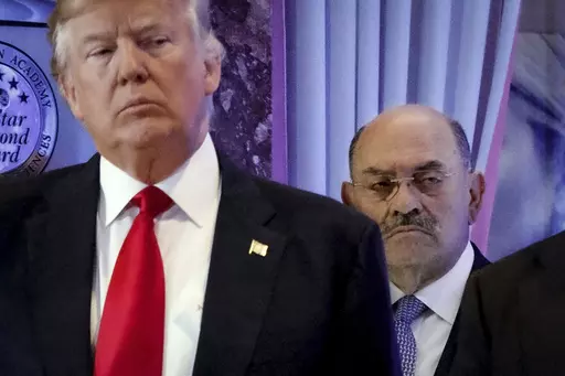 Allen Weisselberg, right, stands behind then President-elect Donald Trump during a news conference in the lobby of Trump Tower in New York, Jan. 11, 2017. A New York judge ruled Friday, Feb. 16, 2024, against Donald Trump, imposing a $364 million penalty over what the judge ruled was a yearslong scheme to dupe banks and others with financial statements that inflated the former president's wealth. (AP Photo/Evan Vucci, File)