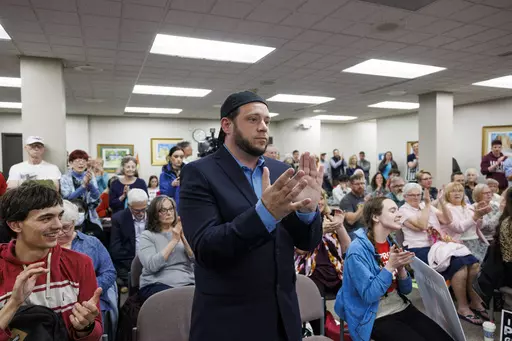 Mark Lee Dickson, a Texas pastor and anti-abortion activist, claps as members of the city council voted to approve an ordinance that would ban the mailing or shipping of abortion pills Tuesday, May 2, 2023 in Danville, Ill. The Illinois city near its eastern border with Indiana on Tuesday banned the mailing or shipping of abortion pills, defying the state's Democratic attorney general and the American Civil Liberties Union who have repeatedly warned that the move violates Illinois law's protecti