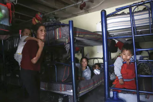 Migrants rest in a dormitory of the Good Samaritan shelter in Juarez, Mexico, on March 29, 2022. The number of migrants attempting to cross the U.S.-Mexico border has surged in recent weeks as the U.S. prepares for even larger numbers with the expected lifting of a pandemic-era order that turned away asylum seekers. (AP Photo/Christian Chavez, File)