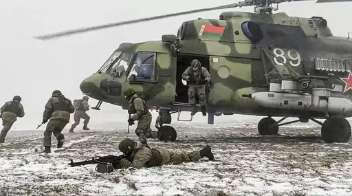 In this photo taken from video and released by the Russian Defense Ministry Press Service on Friday, Feb. 4, 2022, soldiers take part in joint drills between Belarus and Russia at Brestsky firing range in Belarus. Belarus President Alexander Lukashenko has welcomed thousands of Russian troops to his country, allowed the Kremlin to use it to launch the invasion of Ukraine on Feb. 24, 2022, and offered to station some of Moscow’s tactical nuclear weapons there. But he has avoided having Belarus 