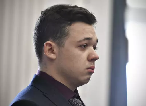 Kyle Rittenhouse keeps his composure while starting to cry as he is found not guilty on all counts on Nov. 19, 2021, at the Kenosha County Courthouse in Kenosha, Wis. A federal judge in Wisconsin on Wednesday, Feb. 1, 2023, ruled that a civil rights wrongful death lawsuit filed by the father of a man shot and killed by Rittenhouse during a protest in 2020 can proceed against city officials, police officers, Rittenhouse and others. (Sean Krajacic/The Kenosha News via AP, Pool, File)