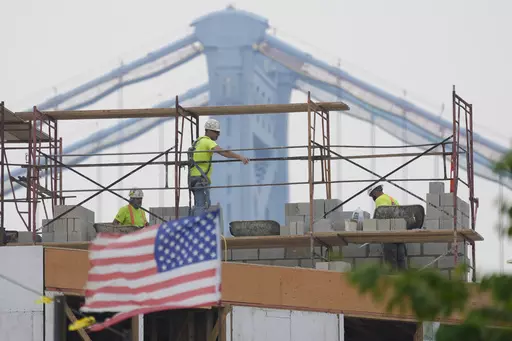 Masons work during hazy conditions in Philadelphia, Wednesday, June 7, 2023. The haze from Canada's wildfires is taking its toll on outdoor workers along the Eastern U.S. who carried on with their jobs even as dystopian orange skies forced the cancelation of sports events, school field trips and Broadway plays. (AP Photo/Matt Rourke, File)