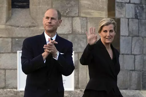 Britain's Prince Edward and Sophie, Countess of Wessex, wave to mourners outside the Windsor Castle in Windsor, England, on Sept. 16, 2022. Britain’s King Charles III has made his youngest brother the Duke of Edinburgh, passing on a title held by their late father, Prince Philip. Buckingham Palace said the title was conferred on Prince Edward on Friday, March 10, 2023, his 59th birthday. (AP Photo/Kin Cheung, File)