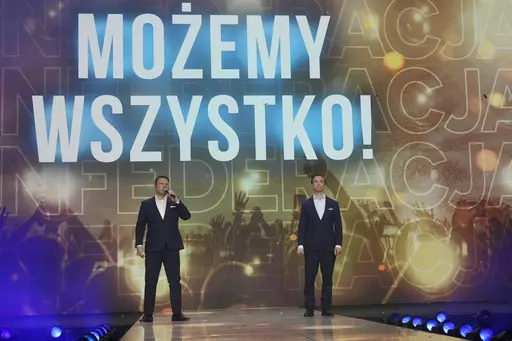 Slawomir Mentzen, left, and Krzysztof Bosak, right, the co-leaders of the hard right Confederation party, present their party slogan "Mozemy Wszystko!" (We Can Do Anything) at a convention in Katowice, Poland, on Saturday, Sept. 23, 2023. Confederation has been growing in popularity, especially among young men. The party has been riding a wave of growing support for far-right parties across Europe, and polls show it could increase its presence in parliament in a national election Oct. 15. No mat