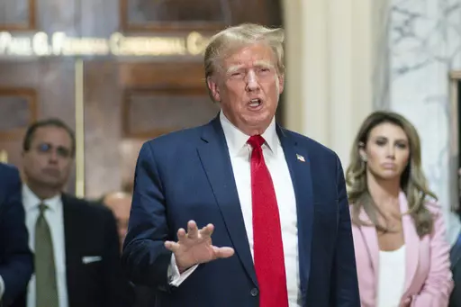Former President Donald Trump speaks after exiting the courtroom for a break at New York Supreme Court, Dec. 7, 2023, in New York. Lawyers for Trump say he may testify at a mid-January trial set to decide how much he owes columnist E. Jean Carroll for defaming her after she said he sexually abused her three decades ago in a Manhattan department store. The lawyers filed papers in Manhattan federal court late Thursday, Dec. 29, 2023, to request that Trump's October 2022 deposition transcript in th