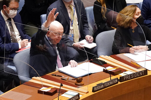 Russia's U.N. Ambassador Russia Vasily Nebenzya casts the lone dissenting vote in the United Nations Security Council, Friday, Feb. 25, 2022. Two days into Russia's attack on Ukraine, a majority of U.N. Security Council members voted to demand that Moscow withdraw. But one thing stood in their way: a veto by Russia itself. Proposals to change the council's structure or rein in the use of vetoes have sputtered for years. But this time, a new approach appears to be gaining some traction. (AP Photo