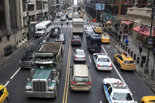 Traffic traverses 42nd Street near Grand Central Terminal, in New York, Jan. 11, 2018. Most drivers would pay $15 to enter Manhattan's central business district under a plan released by New York officials Thursday, Nov. 30, 2023. The congestion pricing plan, which neighboring New Jersey has filed a lawsuit over, will be the first such program in the United States if it receives final approval by transit officials. (AP Photo/Mary Altaffer, File)