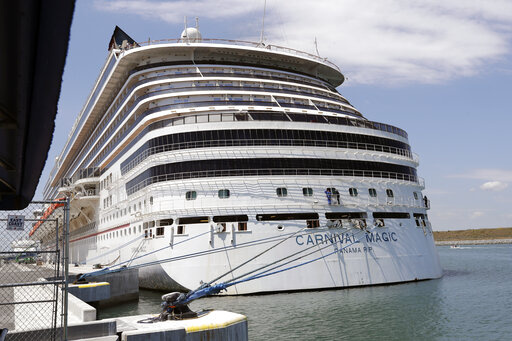 The Carnival cruise line ship Carnival Magic sits docked on April, 2020, in Cape Canaveral, Fla. A crew was dispatched early Thursday, May 26, 2022, to the ship, which is now docked in Norfolk, Virginia, to investigate a chemical smell and passengers feeling ill according to a report the Coast Guard received. (AP Photo/John Raoux, File)