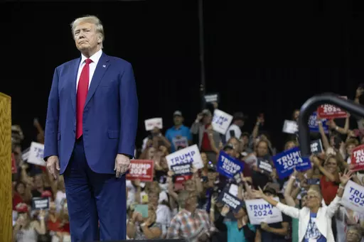 Former President Donald Trump stands as the crowd cheers at the South Dakota Republican Party Monumental Leaders rally Friday, Sept. 8, 2023, in Rapid City, S.D. (AP Photo/Toby Brusseau)