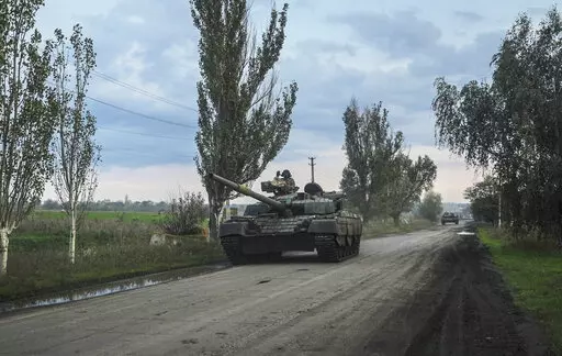 Ukrainian servicemen drive a tank on the way to Siversk, Donetsk region, Ukraine, Saturday, Oct. 1, 2022. (AP Photo/Inna Varenytsia)