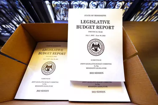 A box of Legislative Budget Reports for the 2023 fiscal year await distribution at the Capitol in Jackson, Miss., Monday, Jan. 3, 2022. Lawmakers begin the latest legislative session on Tuesday, at noon. (AP Photo/Rogelio V. Solis)