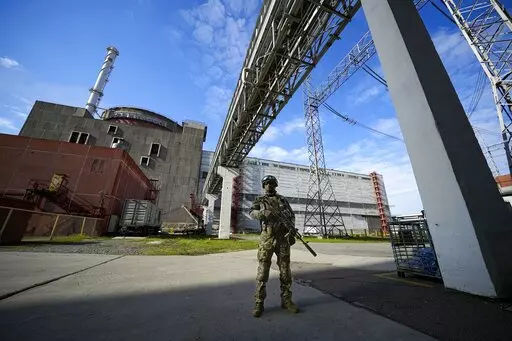 A Russian serviceman guards in an area of the Zaporizhzhia Nuclear Power Station in territory under Russian military control, southeastern Ukraine, on May 1, 2022. Ukraine's Zaporizhzhia nuclear power plant, the biggest in Europe, has lost its last remaining external power source as a result of renewed shelling and is now relying on emergency diesel generators, the U.N. nuclear watchdog said Saturday, Oct. 8, 2022. (AP Photo, File)