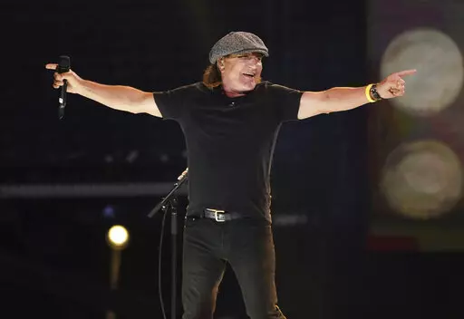 Brian Johnson of AC/DC performs with the Foo Fighters at "Vax Live: The Concert to Reunite the World" in Inglewood, Calif., on May 2, 2021. In his new memoir, the “Highway to Hell” singer recounts how he went from being a vinyl car roof fitter to leading one of the most hailed bands in the world. (Photo by Jordan Strauss/Invision/AP, File)