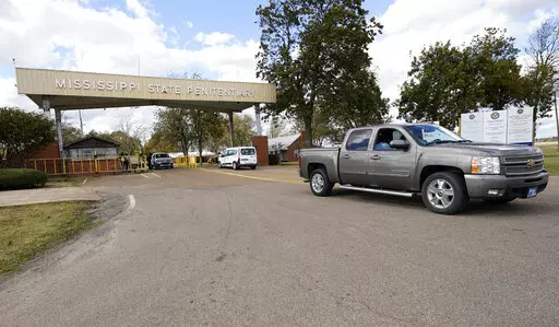 The front gate of the Mississippi State Penitentiary in Parchman, Miss., is shown Nov. 17, 2021. The U.S. Justice Department says it has found "severe, systemic" problems at the Mississippi State Penitentiary at Parchman. The department on Wednesday, April 20, 2022, released findings of its two-year investigation of Parchman, which began after an outburst of violence that left some inmates dead and others injured.  (AP Photo/Rogelio V. Solis, File)