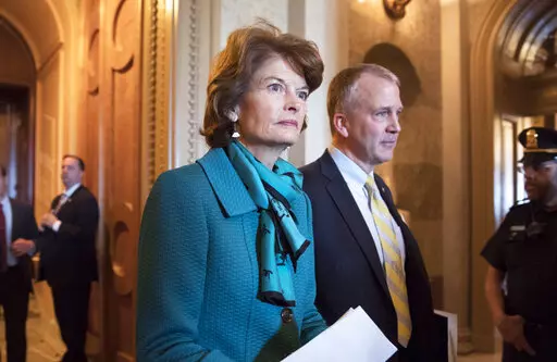 Sen. Lisa Murkowski, R-Alaska, and Sen. Dan Sullivan, R-Alaska, leave the chamber after a vote on Capitol Hill in Washington on May 10, 2017. A rural Alaska man who threatened to kill both of Alaska's U.S. senators in a series of profanity-laden messages left at their congressional offices will be sentenced Friday, April 8, 2022. Jay Allen Johnson, who said he was too old and ill to carry out his threats, partially blamed his behavior on the mixture of pain medications and alcohol and the isolat