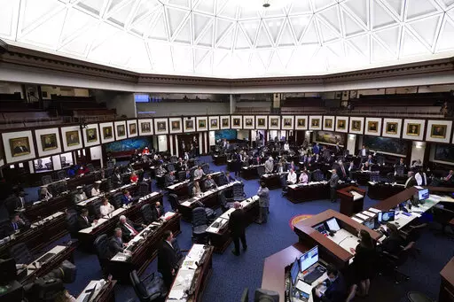 Members of the Florida House of Representatives convene during a legislative session April 30, 2021, at the Capitol in Tallahassee, Fla. On Tuesday, Feb. 22, 2022, Florida House Republicans advanced a bill, dubbed by opponents as the “Don’t Say Gay” bill, to forbid discussions of sexual orientation and gender identity in schools, rejecting criticism from Democrats who said the proposal demonizes LGBTQ people. (AP Photo/Wilfredo Lee, File)