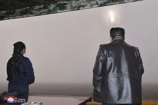 In this photo provided by the North Korean government, North Korean leader Kim Jong Un, right, and his daughter observe what it says a test launch of new intercontinental ballistic missile "Hwasong-19" at an undisclosed place in North Korea Thursday, Oct. 31, 2024. Independent journalists were not given access to cover the event depicted in this image distributed by the North Korean government. The content of this image is as provided and cannot be independently verified. Korean language waterma