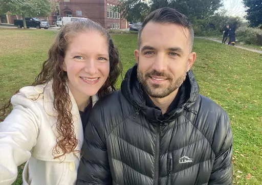 In this undated photo provided by Elizabeth Seal, American Sign Language interpreter Josh Seal poses with his wife, Elizabeth. Josh Seal was one of four deaf people killed in last week's mass shootings in Lewiston, Maine. (Elizabeth Seal via AP)