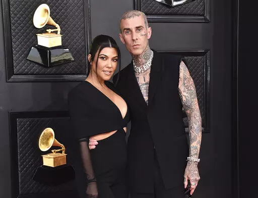 Kourtney Kardashian, left, and Travis Barker appear at the 64th Annual Grammy Awards in Las Vegas on April 3, 2022.   According to reports, Friday, May 20, Kardashian and Barker hit Portofino for a long wedding weekend.  (Photo by Jordan Strauss/Invision/AP, File)