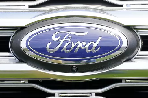 A logo on a vehicle at a Ford dealership in Springfield, Pa., Tuesday, April 26, 2022. Ford is recalling more than 1.5 million vehicles in the U.S. in two actions to fix leaky brake hoses and windshield wiper arms that can break. The company says in documents posted Friday, March 17, 2023 by safety regulators that the front brake hoses can rupture and leak brake fluid. (AP Photo/Matt Rourke, File)