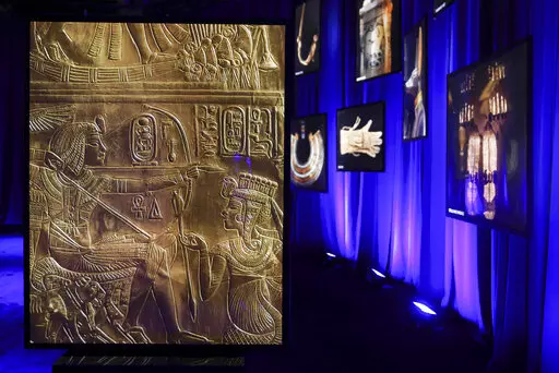 Photos of artifacts found in King Tut's tomb are displayed at the King Tut Immersive Experience, Thursday, Oct. 27, 2022, in New York. The exhibition will open to the public on Friday, in commemoration of the the 100th anniversary of the discovery of King Tut's tomb on Nov. 4, 1922. (AP Photo/Julia Nikhinson)