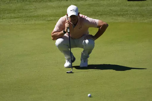 Rory McIlroy of Northern Ireland checks his golfball during the Italian Open golf tournament in Guidonia Montecelio, near Rome, Italy, Sunday, Sept. 18, 2022. The Italian Open took place on the Marco Simone course that will host the 2023 Ryder Cup. (AP Photo/Alessandra Tarantino)