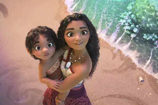 This image released by Disney shows the characters Moana, voiced by Auli'i Cravalho, holding Simea, voiced by Khaleesi Lambert-Tsuda, in a scene from "Moana 2." (Disney via AP)