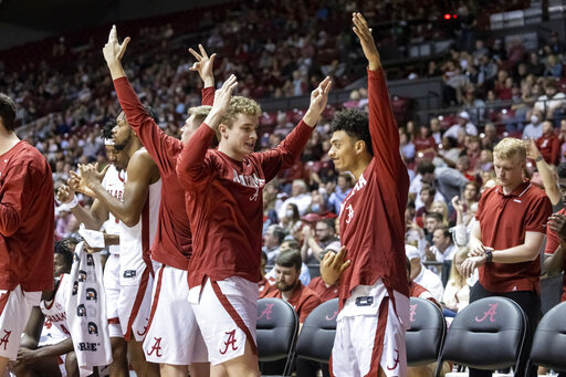 Alabama's bench celebrates a 3-point shot during the second half of the team's NCAA college basketball game against Mississippi State, Wednesday, Feb. 16, 2022, in Tuscaloosa, Ala. (AP Photo/Vasha Hunt)