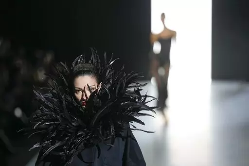 A model wears a creation as part of the Dolce & Gabbana women's Fall-Winter 2023-24 collection presented in Milan, Italy, Saturday, Feb. 25, 2023. (AP Photo/Antonio Calanni)