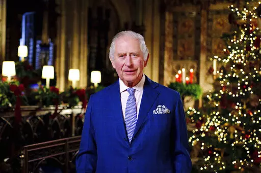 Britain's King Charles III delivers his message during the recording of his first Christmas broadcast in the Quire of St George's Chapel at Windsor Castle, Berkshire, England, Tuesday, Dec. 13, 2022. King Charles III evoked memories of his late mother, Queen Elizabeth II, as he broadcast his first Christmas message as monarch on Sunday, Dec. 25, 2022, in a speech that also paid tribute to the “selfless dedication” of Britain’s public service workers, many of whom are in a fight with the go