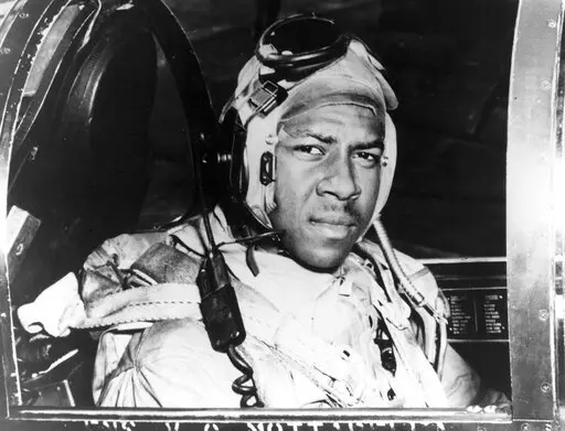 This circa 1950 photo provided by the U.S. Navy shows Jesse Brown in the cockpit of an F4U-4 Corsair fighter at an unidentified location. In December 2022, FedEx founder Fred Smith gifted the proceeds from the film “Devotion,” which he financed, that tells the story of groundbreaking Naval aviators Brown and Thomas Hudner. The proceeds will fund in part scholarships for the children of Navy service members studying STEM. (U.S Navy via AP, File)