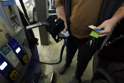 A customer prepares to pump gasoline into his car at a Sam's Club fuel island in Gulfport, Miss., Feb. 19, 2022. For the 12 months ending in March, consumer prices surged 8.5% — posting the fastest year-over-year pace since December 1981 and topping February's previous 40-year high of 7.9%, the Labor Department said Tuesday, April 12. Even if you toss out volatile food and energy prices, so-called core inflation jumped 6.5% in March from a year earlier. That was also the sharpest such jump in 
