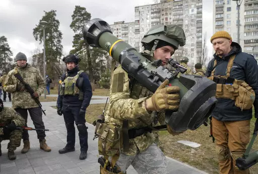 A Ukrainian Territorial Defence Forces member holds an NLAW anti-tank weapon, in the outskirts of Kyiv, Ukraine, March 9, 2022. (AP Photo/Efrem Lukatsky, File)