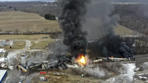 This photo taken with a drone shows portions of a Norfolk and Southern freight train that derailed Friday night in East Palestine, Ohio are still on fire at mid-day Saturday, Feb. 4, 2023. Soon after the train derailed and spilled toxic chemicals in Ohio last month, anonymous pro-Russian accounts started spreading misleading claims and anti-American propaganda about it on Twitter, using Elon Musk's new verification system to expand their reach while creating the illusion of credibility. (AP Phot