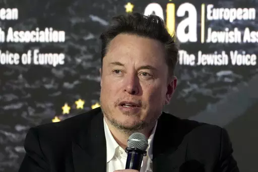 Elon Musk addresses the European Jewish Association's conference, in Krakow, Poland, Monday, Jan. 22, 2024. Musk is suing OpenAI and its CEO Sam Altman, Thursday, Feb. 29, over what he says is a betrayal of the ChatGPT maker's founding aims of benefiting humanity rather than pursuing profits. (AP Photo/Czarek Sokolowski, File)