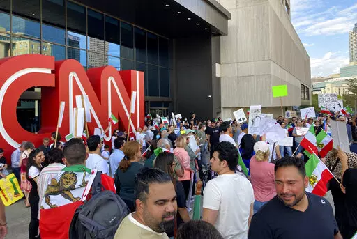 Iranian Americans demonstrate in support of protesters in Iran on Sunday, Sept. 25, 2022, in Atlanta The demonstration comes amid violent unrest in Iran triggered by the death of a young woman in police custody. (AP Photo/Jeff Amy)