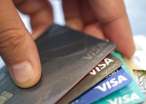 Visa credit cards are seen on Aug. 11, 2019, in New Orleans. Payment processor Visa Inc. said late Saturday, Sept. 10, 2022, that it plans to start separately categorizing sales at gun shops. (AP Photo/Jenny Kane, File)