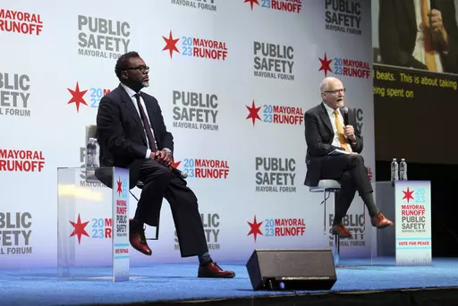 Chicago mayoral candidates Brandon Johnson, left, and Paul Vallas participate in a public safety forum in Chicago, Tuesday, March 14, 2023. In heavily Democratic Chicago, the race to be the city's next mayor is between a progressive union member, Johnson, and a more moderate former schools CEO, Vallas. The increasingly bitter April 4 contest is another example of broader tension among Democrats. (AP Photo/Teresa Crawford)