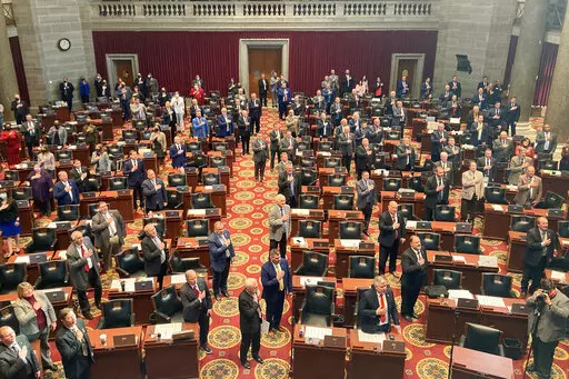 Members of the Missouri House of Representatives recite the Pledge of Allegiance as they begin their annual legislative session, Jan. 5, 2022, in Jefferson City, Mo. Women who serve in the Missouri House will face a tougher dress code when they return to the floor this week after a debate that Democrats panned as a pointless distraction from the issues facing the state. The new rules require female legislators and staff members to wear a jacket such as a cardigan or blazer. The Republican lawmak