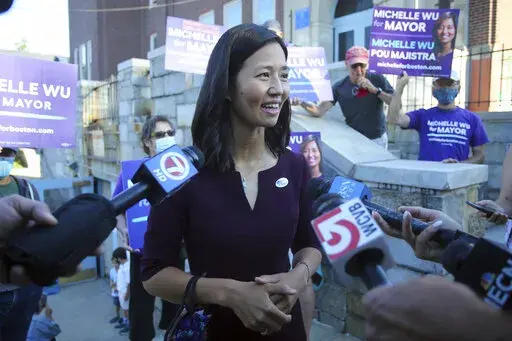 Boston mayoral candidate Michelle Wu speaks with the media after casting her ballot in the Mayoral race on Election Day, at the Phineas Bates Elementary School in Boston, Tuesday, Sept. 14, 2021. (AP Photo/Stew Milne)