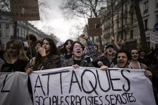 Protesters march during a rally in Paris, on March 23, 2023. French President Emmanuel Macron has ignited a firestorm of anger with unpopular pension reforms that he rammed through parliament. Young people, some of them first-time demonstrators, are joining protests against him. Violence is also picking up. (AP Photo/Christophe Ena, File)