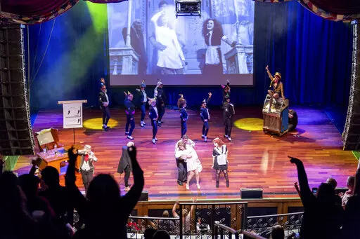 This image shows a live performance of "The Rocky Horror Picture Show" in Atlantic City, N.J., on Oct. 26, 2013. A touring, interactive version of “The Rocky Horror Picture Show” is hitting the road to celebrate the cult film’s birthday with screenings, live shadow casts. (Dennis Parrington via AP)