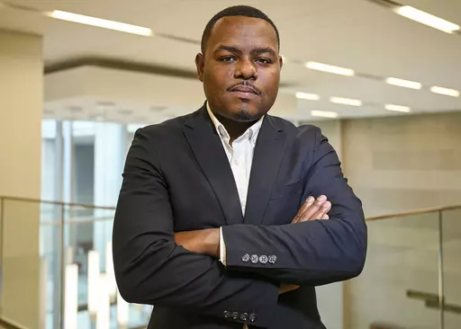 In this photo provided by the Mississippi Department of Archives and History, Michael Morris poses for a picture on the day he was named director of the Museum of Mississippi History and the Mississippi Civil Rights Museum, Monday, July 10, 2023, in Jackson, Miss. The two museums are under one roof in downtown Jackson, and they opened in December 2017. Morris has worked for the MDAH since 2016. (Rodney Thompson/Courtesy of Mississippi Department of Archives and History via AP)