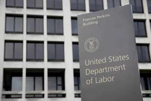 A sign stands outside the U.S. Department of Labor's headquarters, May 6, 2020, in Washington. The U.S. Department of Labor’s Occupational Safety and Health Administration found numerous safety violations in its investigation of the July 2023 workplace accident that caused the death of Duvan Pérez, a Guatemalan teenager who had been a contract worker at the Mar-Jac Poultry plant in Hattiesburg, Miss., the agency said in a news release on Tuesday, Jan. 16, 2024. (AP Photo/Patrick Semansky, Fil