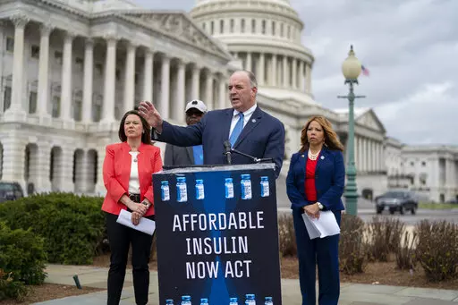 From left, Rep. Angie Craig, D-Minn., House Majority Whip James Clyburn, D-S.C., Rep. Dan Kildee, D-Mich., Rep. Lucy McBath, Ga., talk about their legislation aimed at capping the price of insulin, at the Capitol in Washington, Thursday, March 31, 2022. The bill would keep consumers' out-of-pocket costs at no more than $35 per month. (AP Photo/J. Scott Applewhite)
