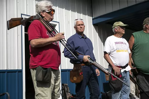 Former Vice President and current 2024 Republican presidential candidate Mike Pence receives safety instructions before his turn to shoot during the 10th annual Jasper County GOP trap shoot on Saturday, Sept. 16, 2023, at Jasper County Gun Club in Newton, Iowa. Four Republican presidential hopefuls, made a campaign stop at the event to speak with constituents and shoot a few rounds. (Geoff Stellfox/The Gazette via AP)