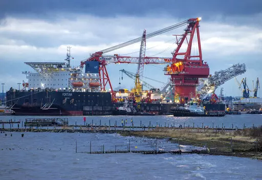 A tugboats get into position on the Russian pipe-laying vessel "Fortuna", being used for construction work on the German-Russian Nord Stream 2 gas pipeline in the Baltic Sea, in the port of Wismar, Germany, on Jan 14, 2021. European leaders are turning to Africa for more natural gas as the EU tries to replace Russian exports amid the war in Ukraine. (Jens Buettner/dpa via AP, File)