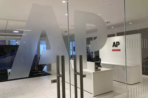 The Associated Press logo is shown at the entrance to the news organization's office in New York on Thursday, July 13, 2023. The Associated Press has issued guidelines for its journalists on use of artificial intelligence, saying the tool cannot be used to create publishable content and images for the news service. (AP Photo/Aaron Jackson, File