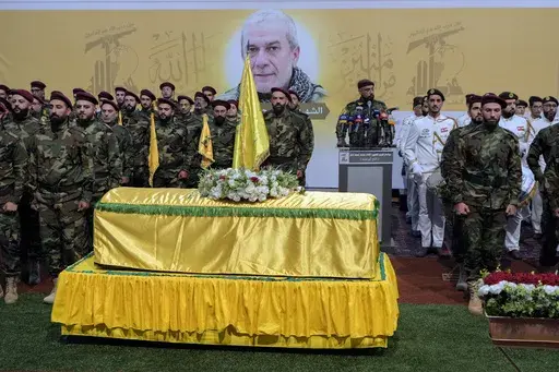 Hezbollah fighters attend the funeral procession of their comrade, senior commander Mohammad Naameh Nasser, who was killed by an Israeli airstrike that hit his car in the southern costal town of Tyre, in the southern suburbs of Beirut, Lebanon, Thursday, July 4, 2024. The strike took place as global diplomatic efforts have intensified in recent weeks to prevent escalating clashes between Hezbollah and the Israeli military from spiralling into an all-out war that could possibly lead to a direct c